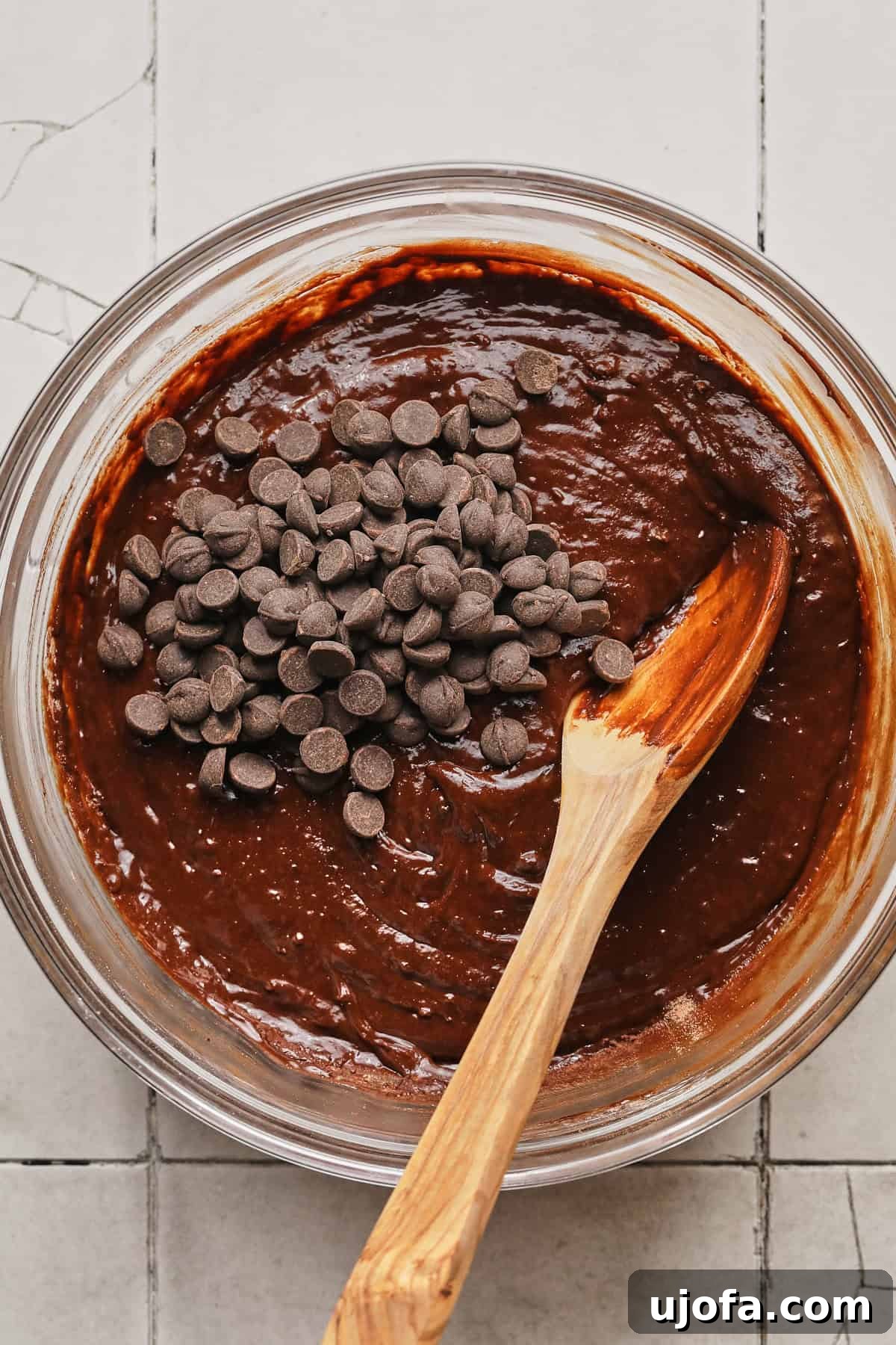 Stirring chocolate chips into high-protein brownie batter