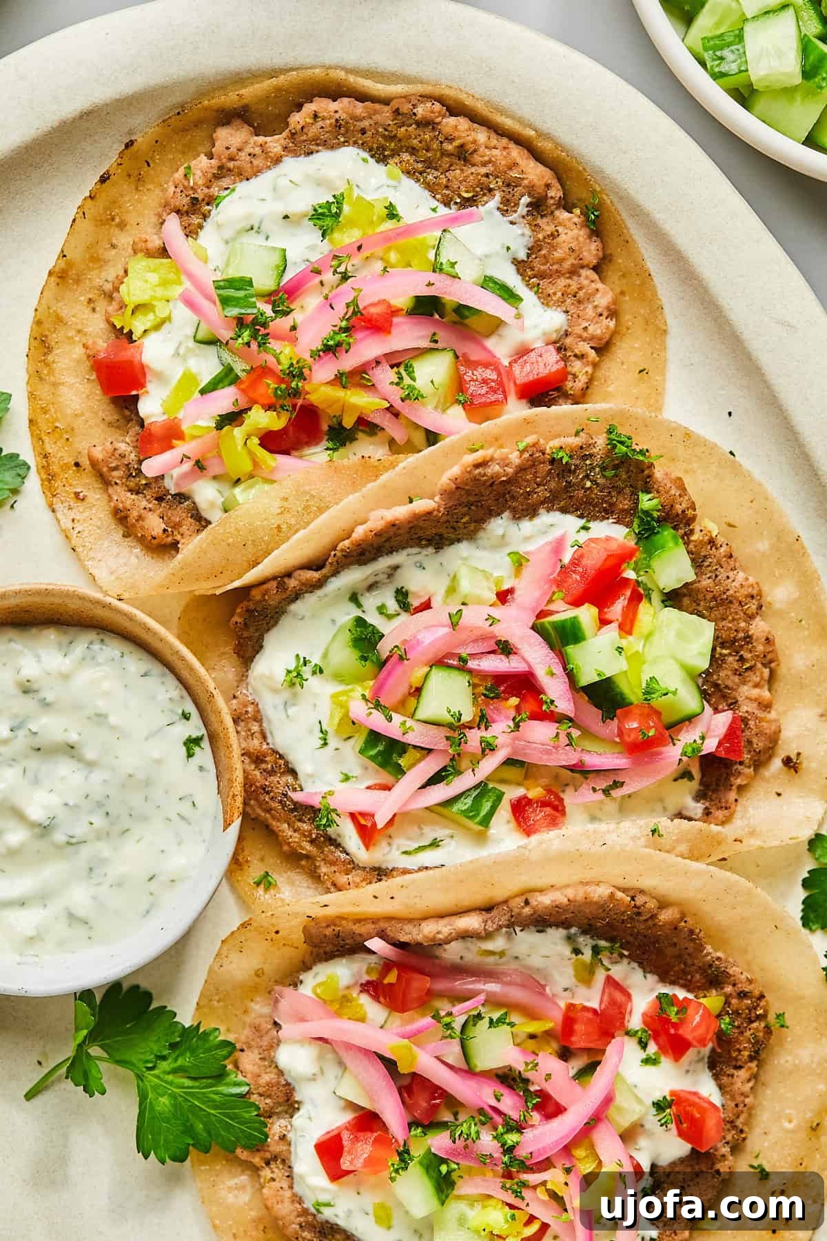 Turkey Gyro Smash Tacos 2 Greek turkey smash burger tacos, showcasing a beautifully cooked taco with fresh toppings