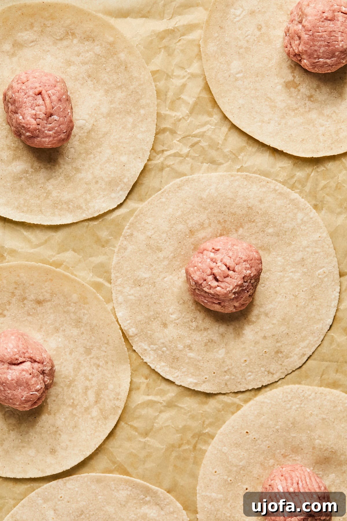 Turkey Gyro Smash Tacos 6 Balls of turkey meat placed on tortillas ready for smashing