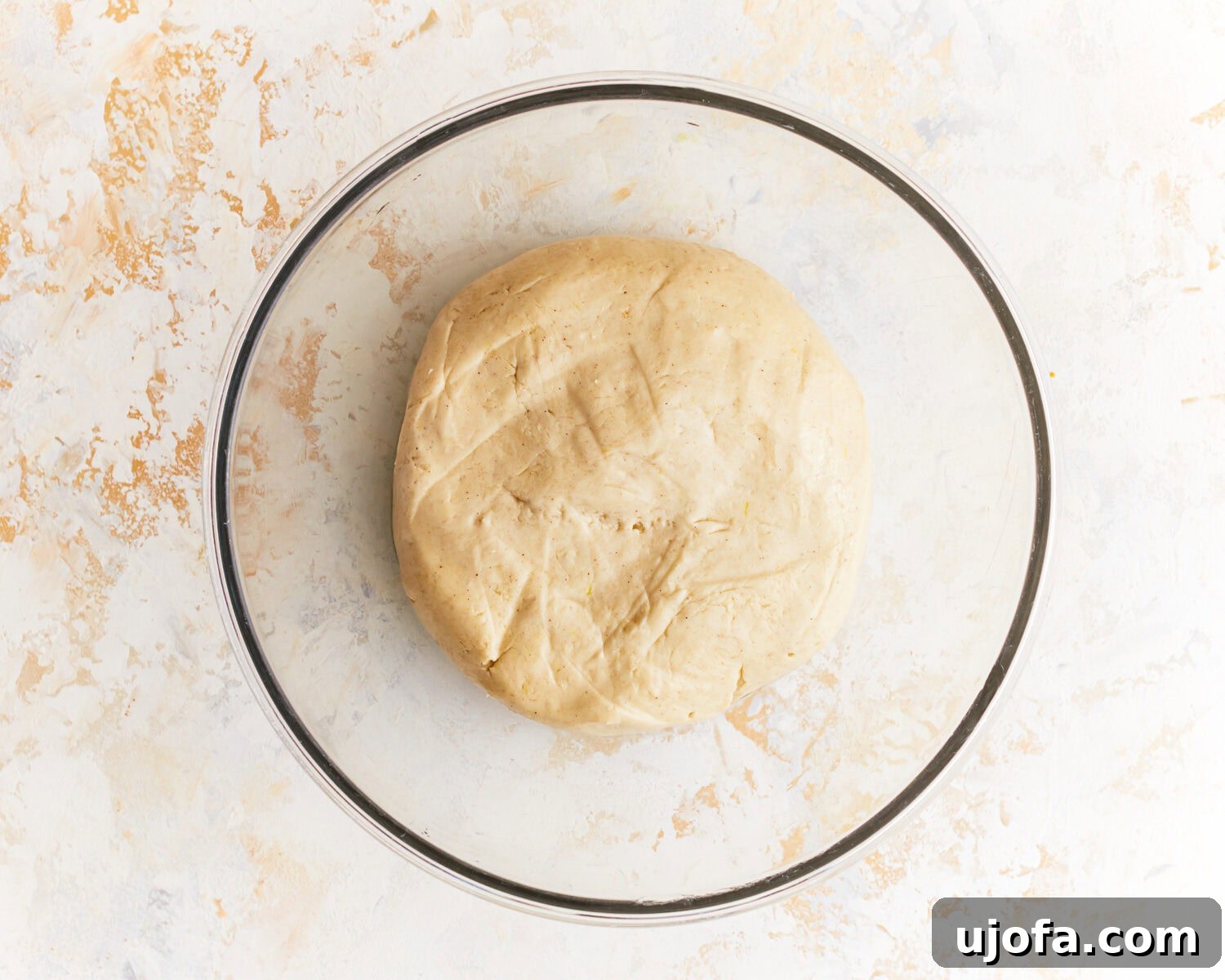 Hearty Gluten-Free Potato Loaf 8 Smooth dough for gluten free potato bread in a glass mixing bowl.