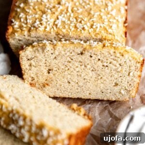 a partially sliced loaf of coconut flour bread.