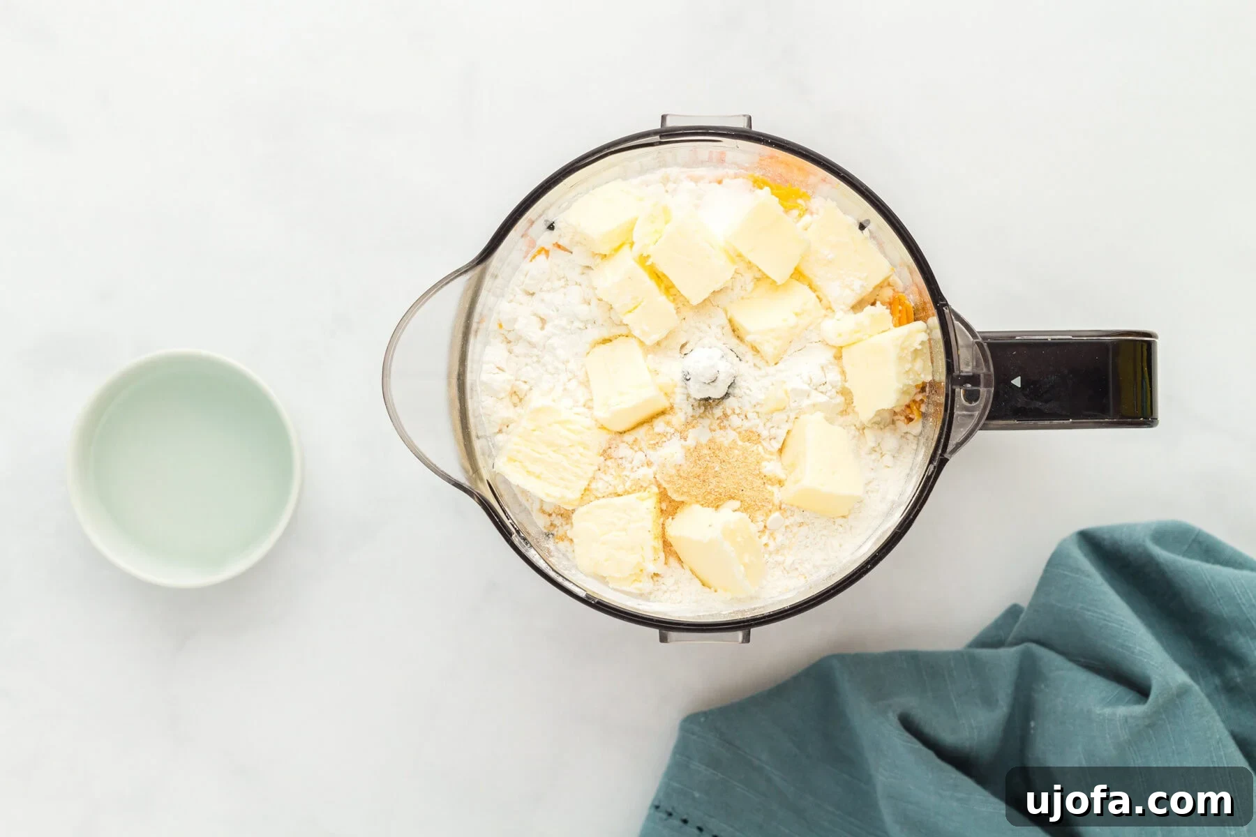 Ingredients for gluten-free Cheez-Its in a blender, ready to be processed.