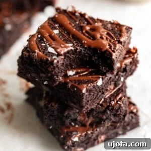 Fudgy Coconut Flour Brownies 6 A stack of coconut flour brownies.