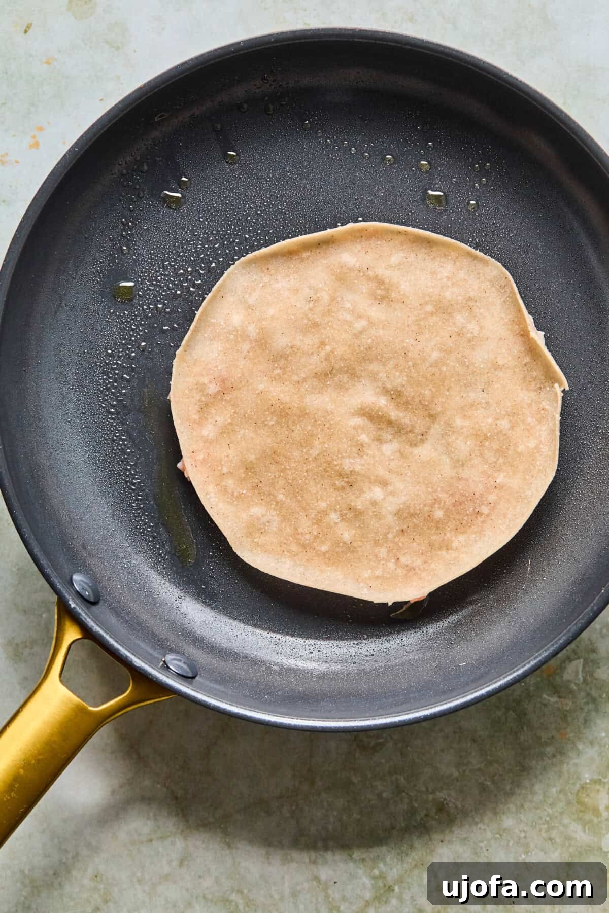 step 5: smashed chicken side of taco searing in skillet