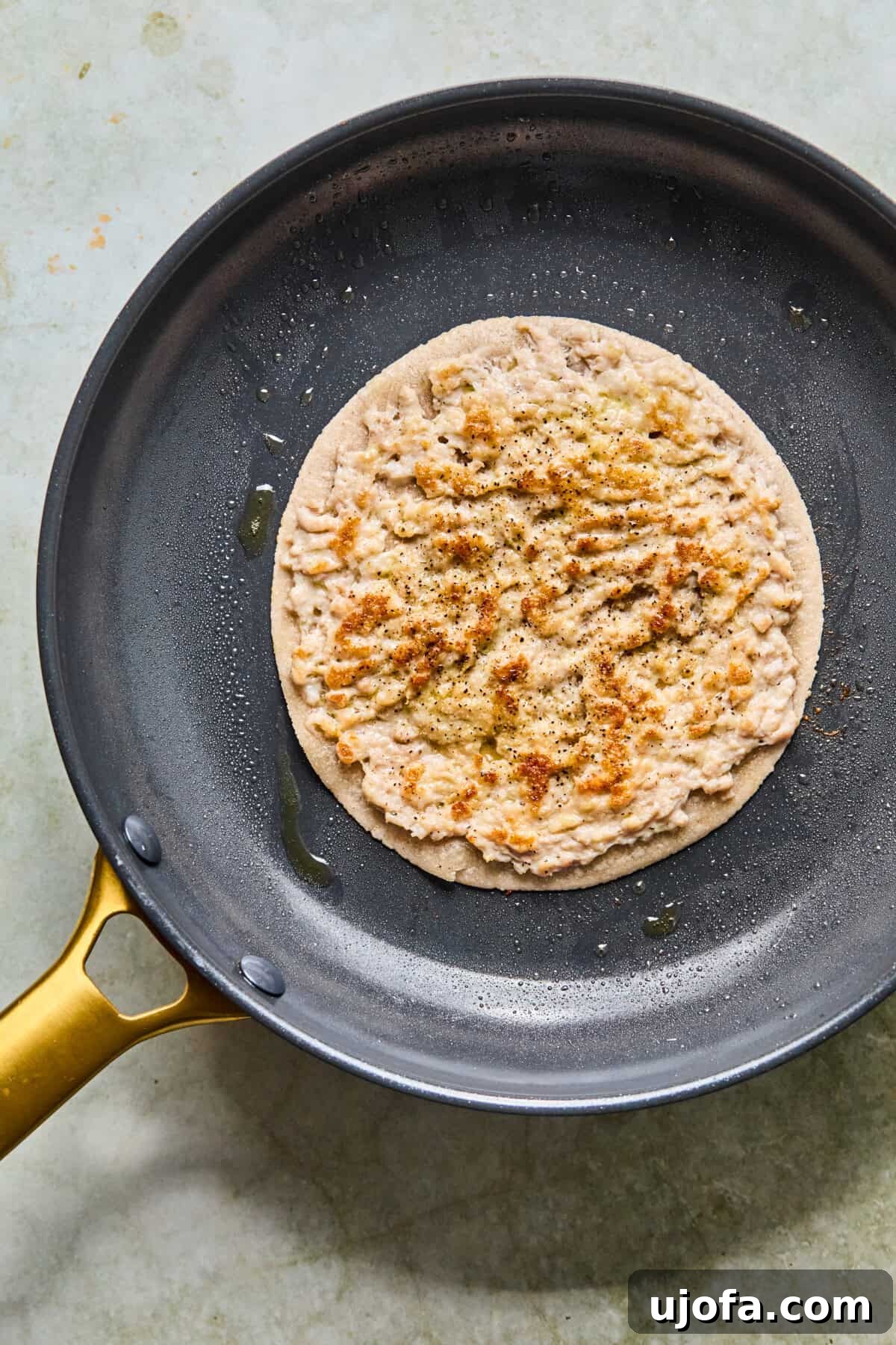 step 6: golden tortilla with seared chicken in cast iron pan