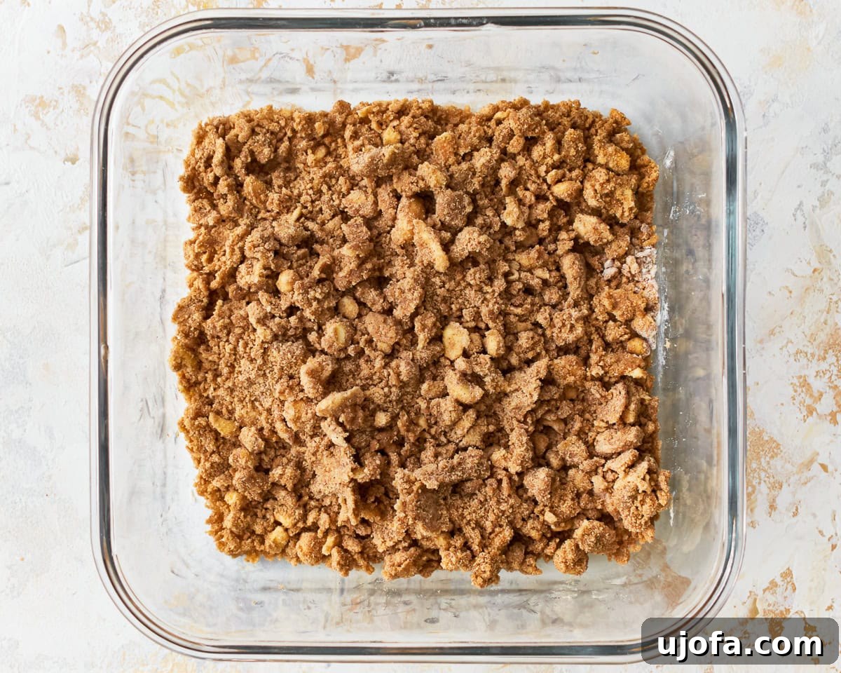 Golden Gluten-Free Peach Crisp 9 The crisp for gluten-free peach crisp in a glass baking dish.