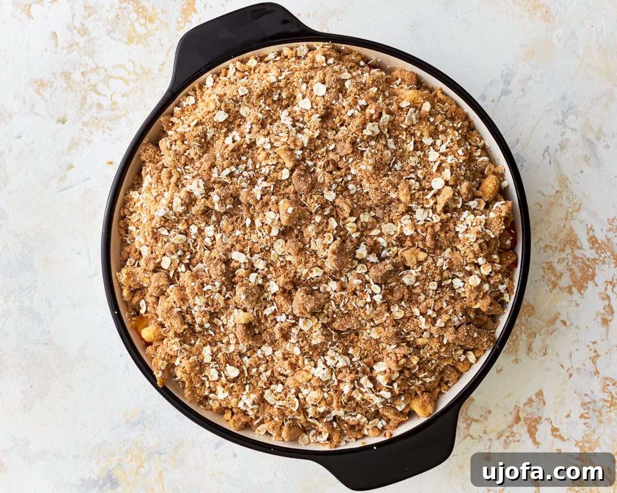 Golden Gluten-Free Peach Crisp 11 Gluten-free peach crisp in a baking dish ready to be baked