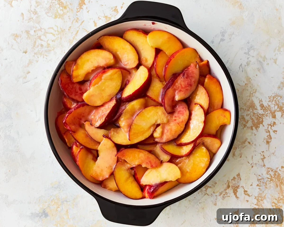 Golden Gluten-Free Peach Crisp 7 Sliced peaches in a baking dish.
