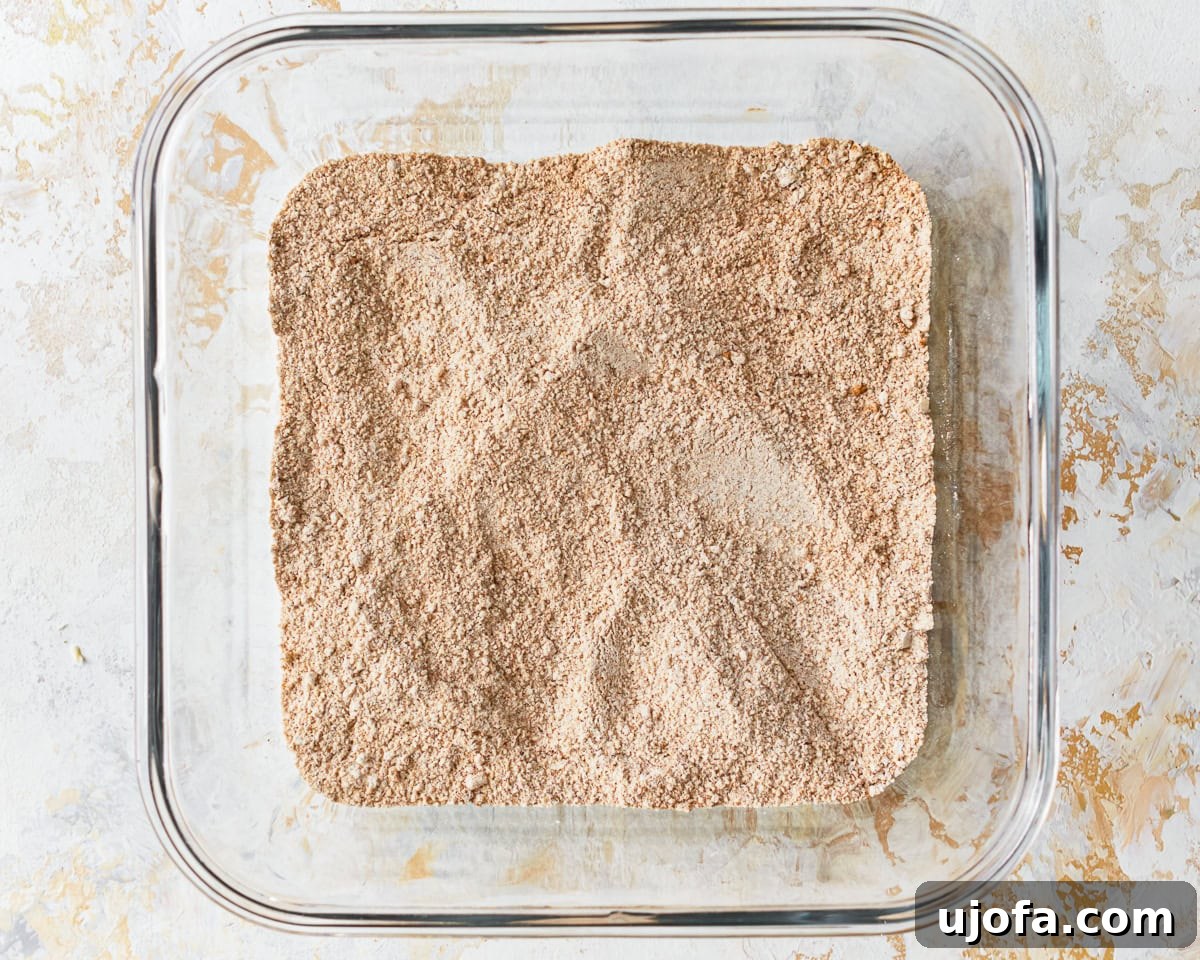 Golden Gluten-Free Peach Crisp 8 Sugar, flour, cinnamon, and salt in a glass baking dish for gluten-free peach crisp