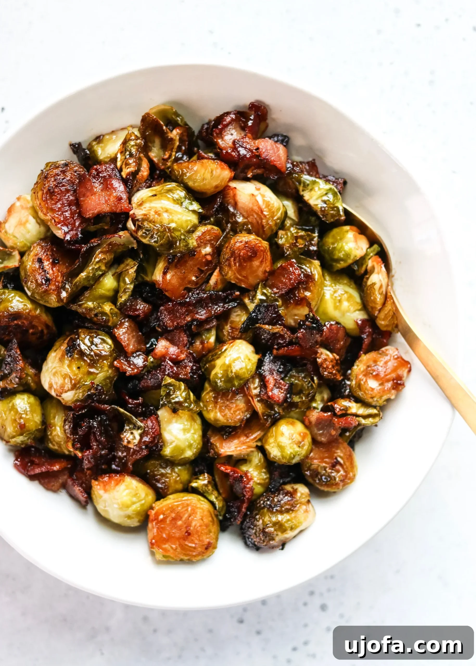 Crispy 'Soy' Glazed Brussels Sprouts with Bacon on a baking sheet