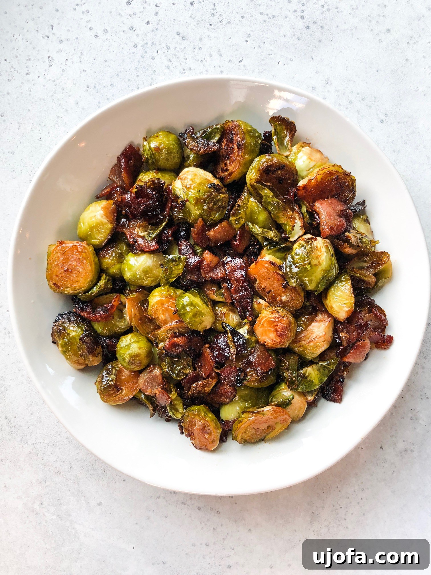 Close-up of crispy Brussels sprouts and bacon in a bowl
