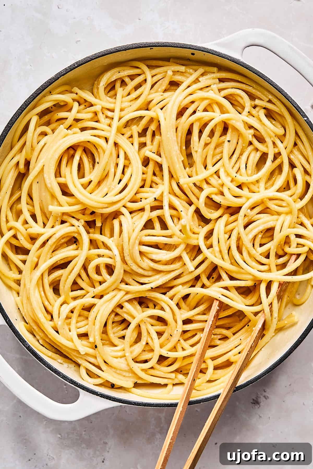 Simple 5 Ingredient Gluten Free Bucatini Cacio e Pepe 7 Finished cacio e pepe pasta in skillet with creamy cheese sauce