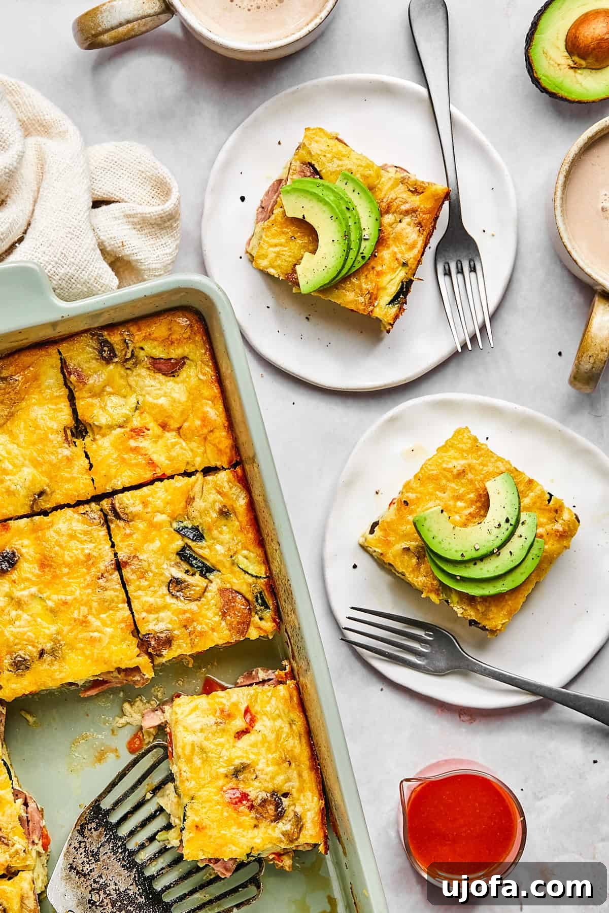 Hearty Cottage Cheese and Chicken Sausage Brunch Bake 2 Cottage cheese egg bake in a baking dish, golden brown on top and sliced