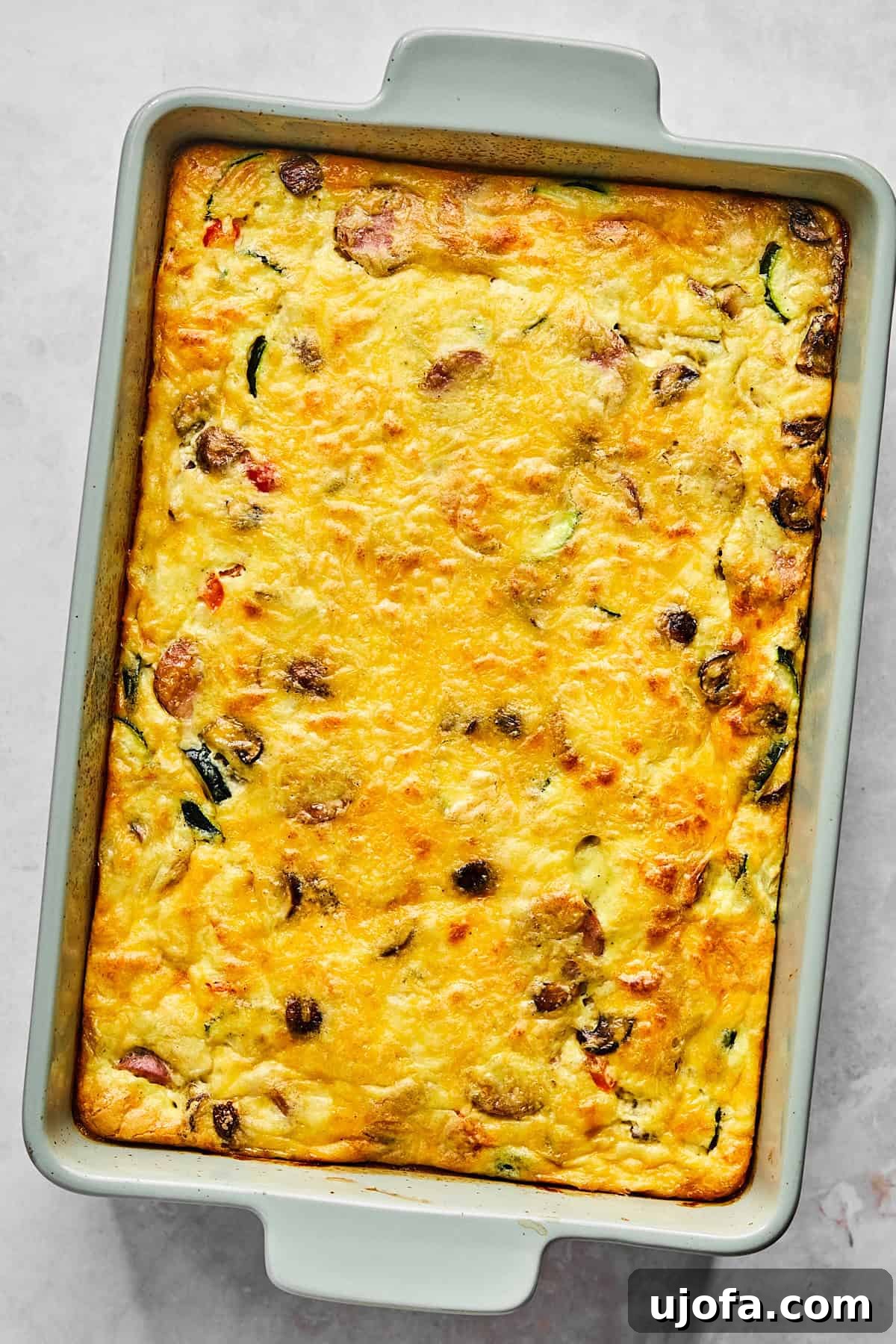 Hearty Cottage Cheese and Chicken Sausage Brunch Bake 9 Fully baked cottage cheese egg casserole resting on the counter, golden and bubbly