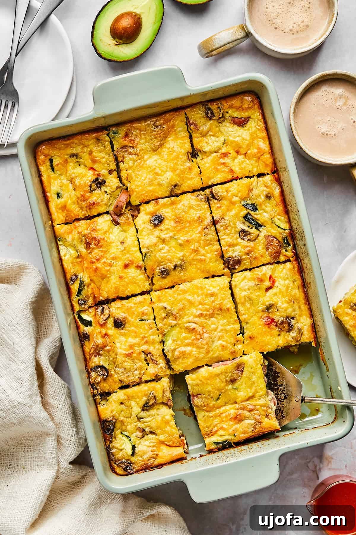 Hearty Cottage Cheese and Chicken Sausage Brunch Bake 10 Cottage cheese egg bake in a baking dish, golden brown on top and sliced