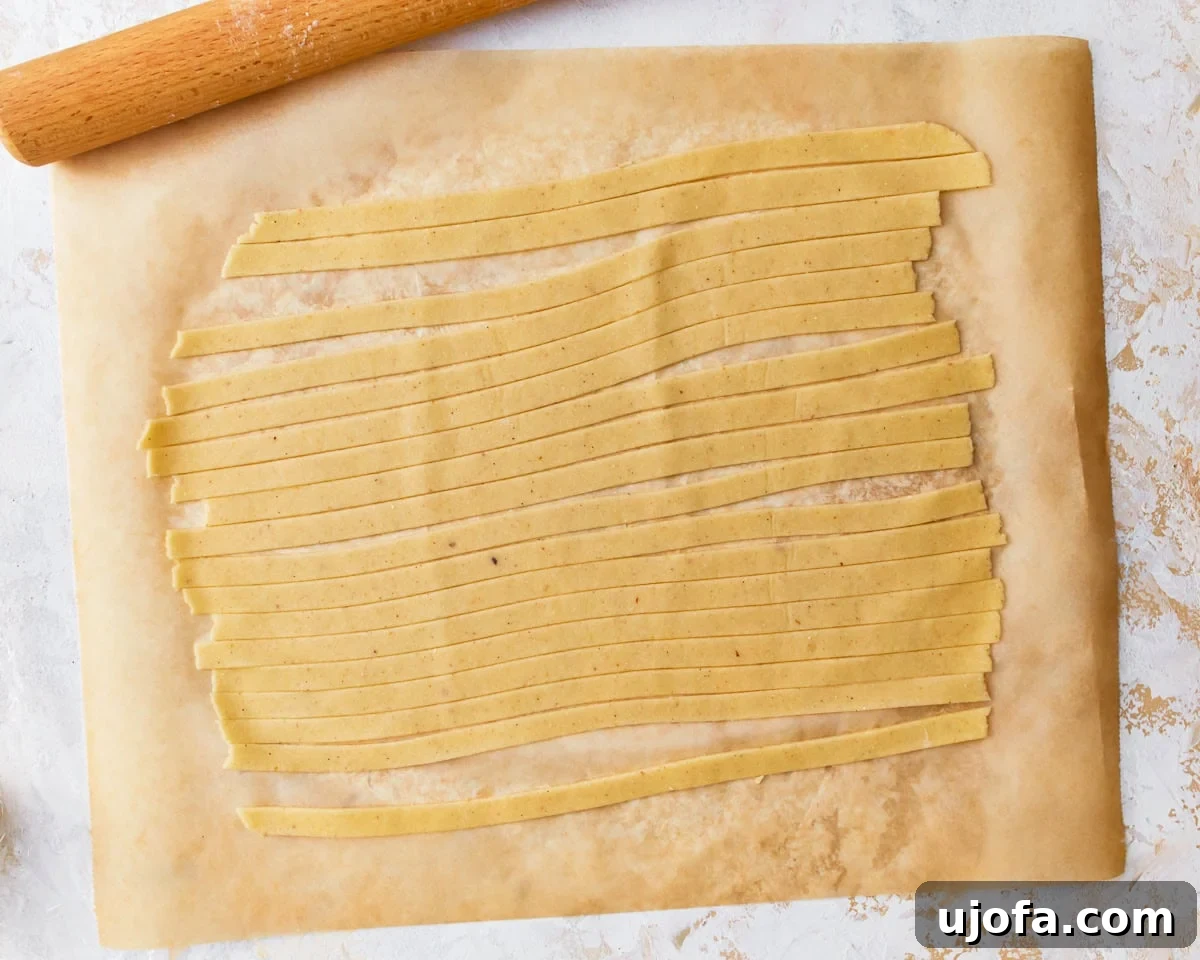 Almond flour pasta dough sliced into strips