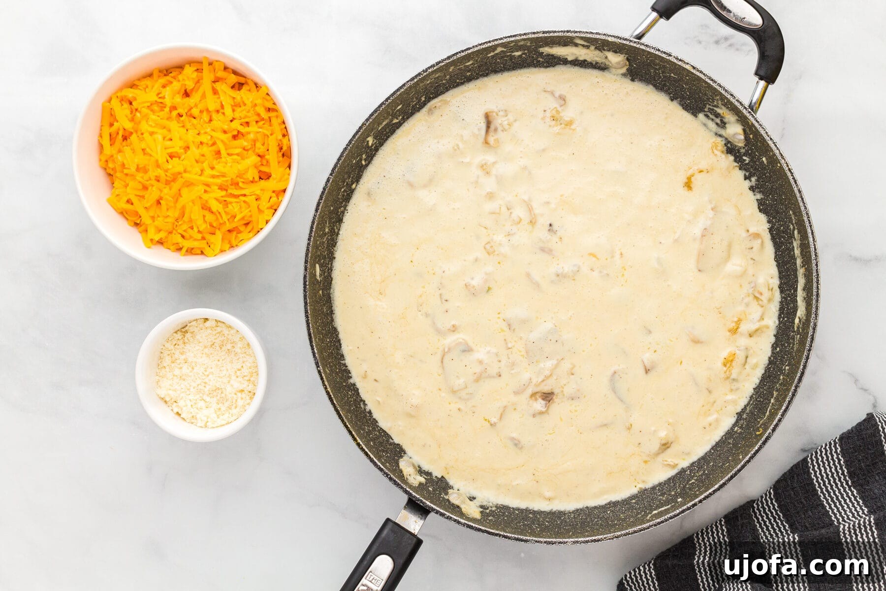 Thickened creamy sauce for gluten-free tuna casserole in a skillet