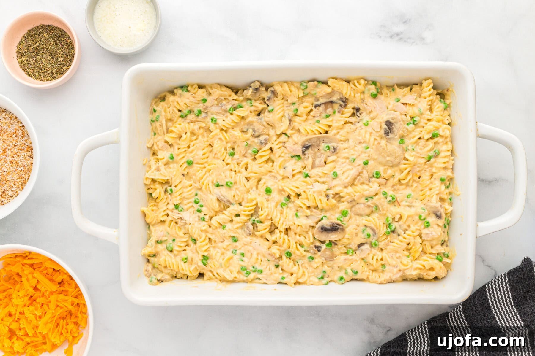 Noodles and sauce in a baking dish for gluten-free casserole
