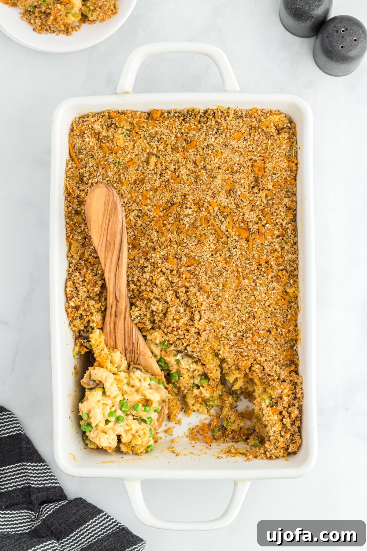 Gluten-free tuna casserole in a baking dish with a spoon