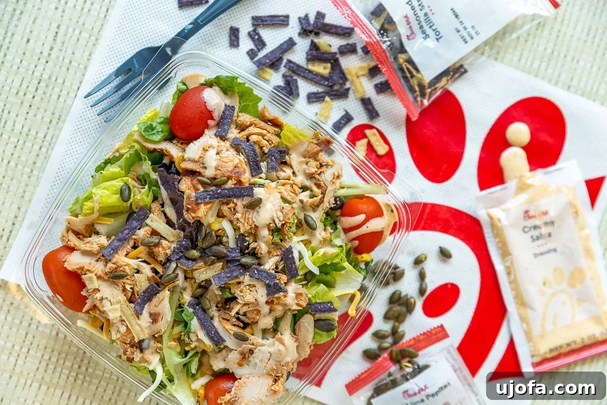 A refreshing Market Salad featuring a tender grilled filet from Chick-fil-A, a popular choice for health-conscious diners.