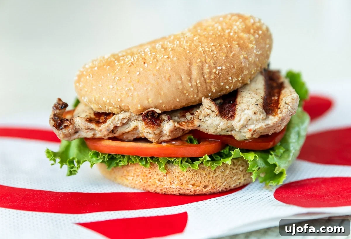 A delicious grilled filet chicken sandwich served on a gluten-free bun from Chick-fil-A, offering a compliant meal option.