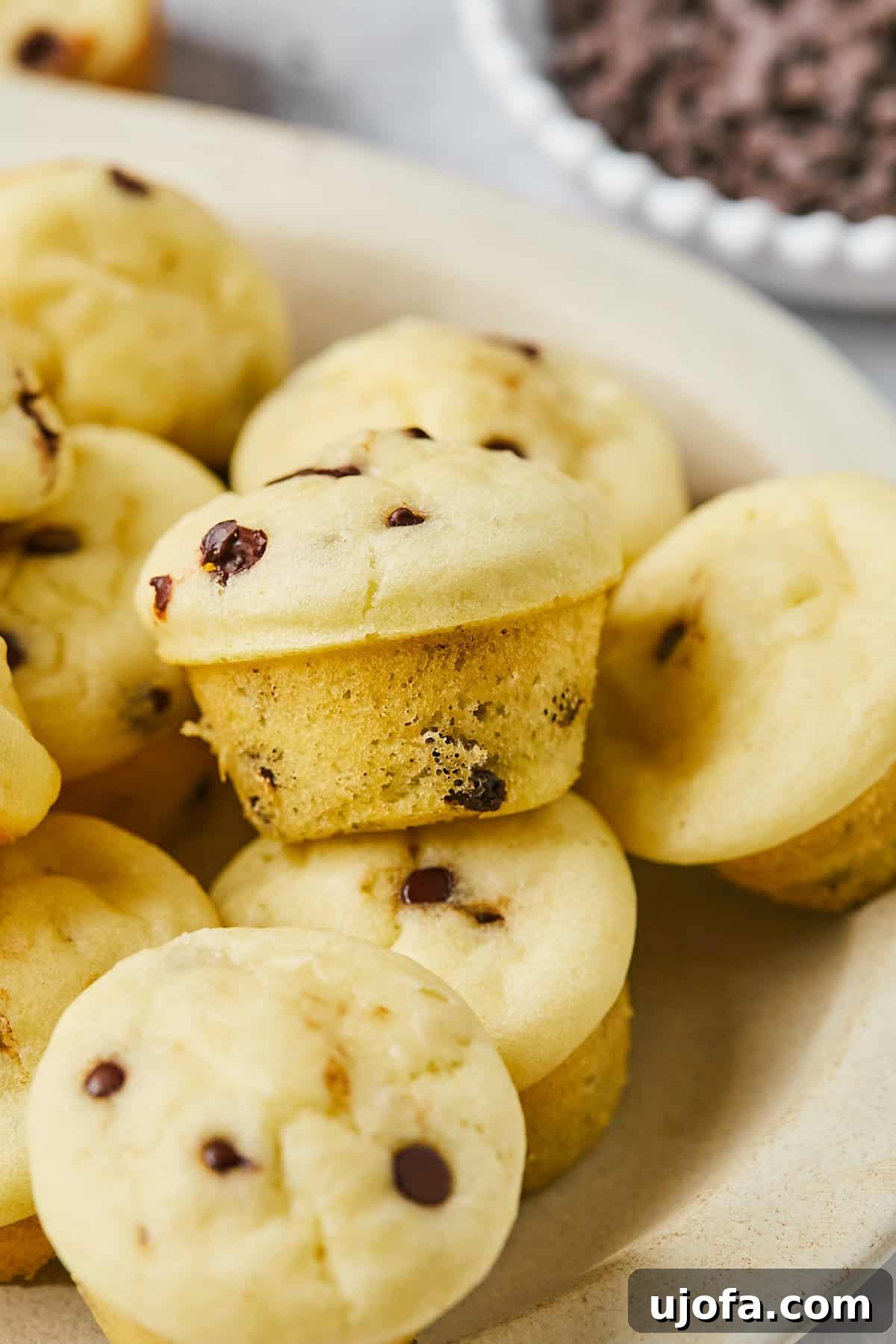 Close-up of a gluten-free mini muffin showing its soft, fluffy crumb