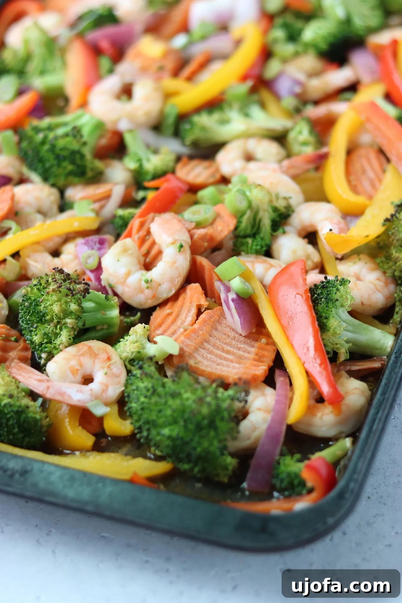 Colorful Whole30 Sheet Pan Shrimp Stir Fry with various vegetables and shrimp, ready to serve.