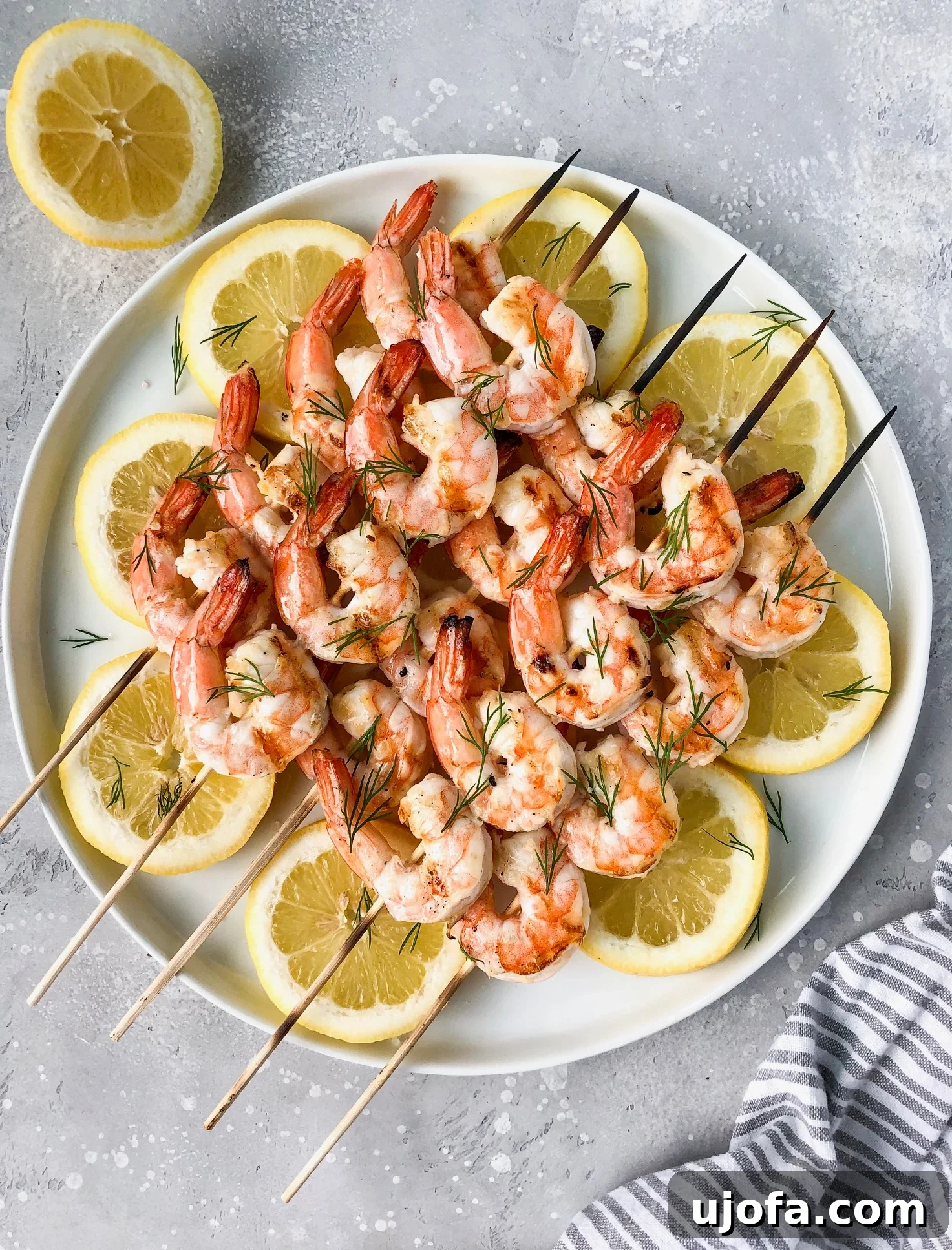 Succulent Whole30 Grilled Garlic Lemon Dill Shrimp skewers, fresh off the grill.