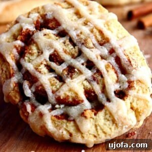 An appetizing display of Gluten-Free Cinnamon Roll Cookies, beautifully swirled and glazed, capturing their delicious texture and inviting aroma.