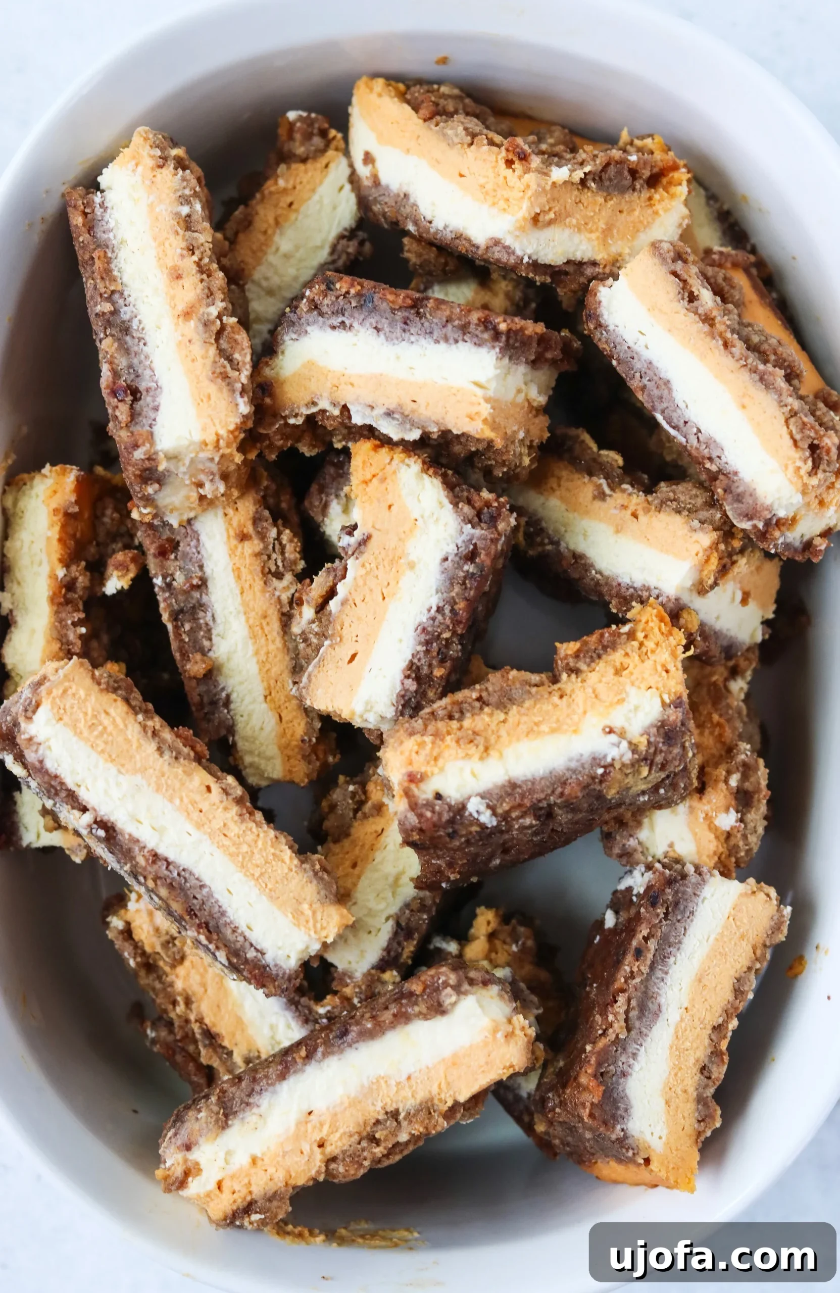 Delightful Dairy-Free Grain-Free Pumpkin Cheesecake Bars 3 Pecan crust and creamy cheesecake filling layers