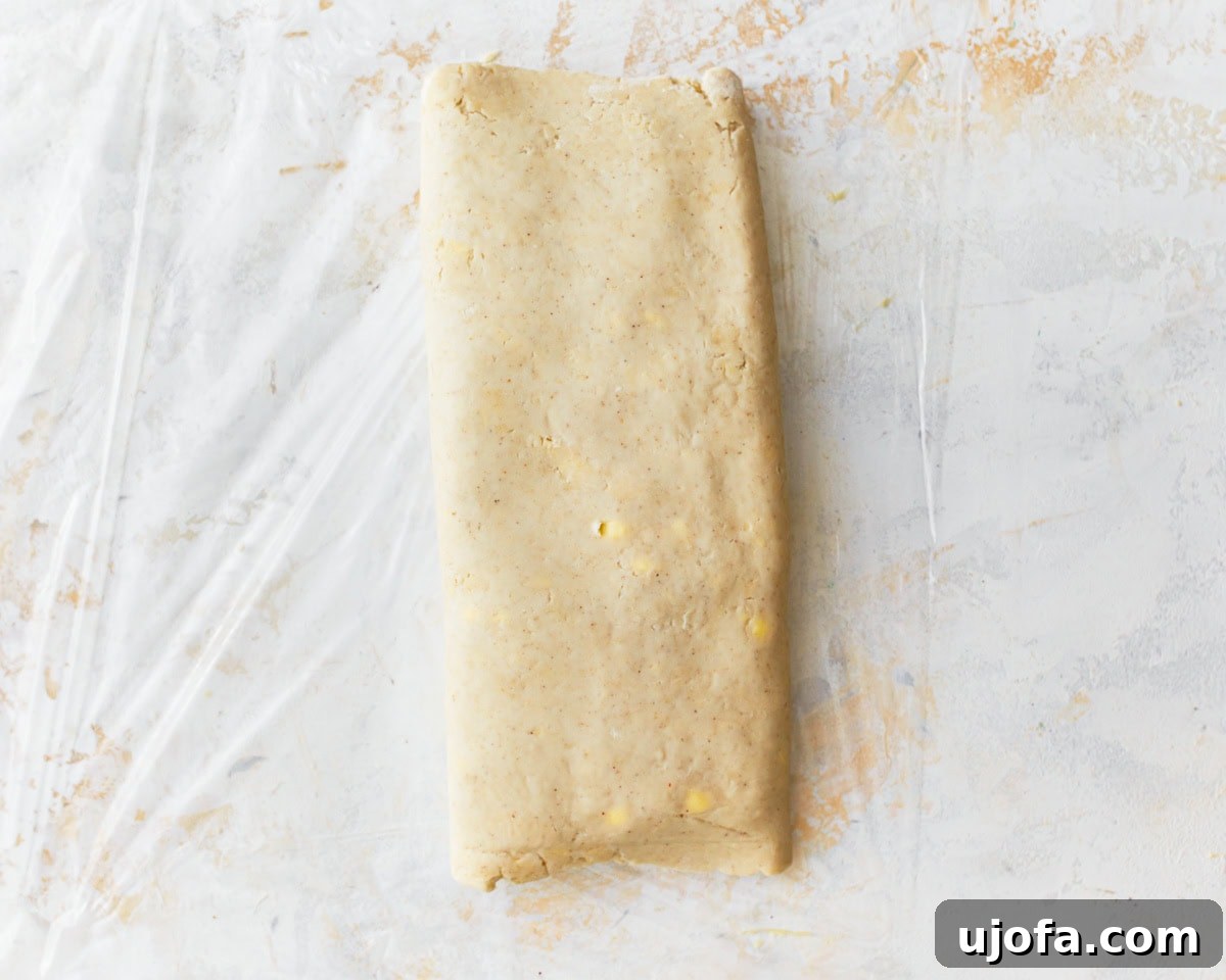 The gluten-free puff pastry dough fully folded into a three-layered rectangle, completing the first turn.
