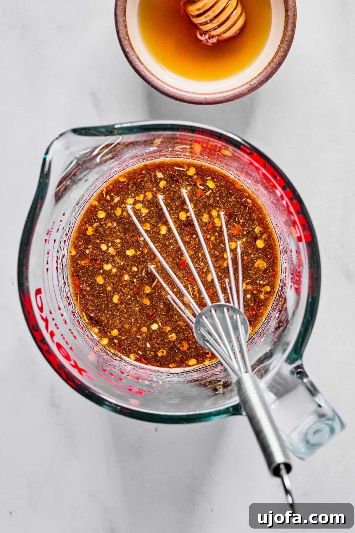 Speedy Chicken and Broccoli Stir-Fry 4 Stir fry sauce ingredients in a glass measuring cup whisked together.