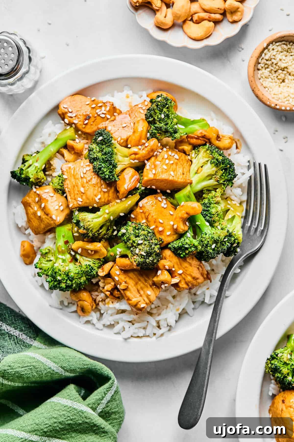 Speedy Chicken and Broccoli Stir-Fry 8 chicken broccoli stir fry over white rice on a white plate