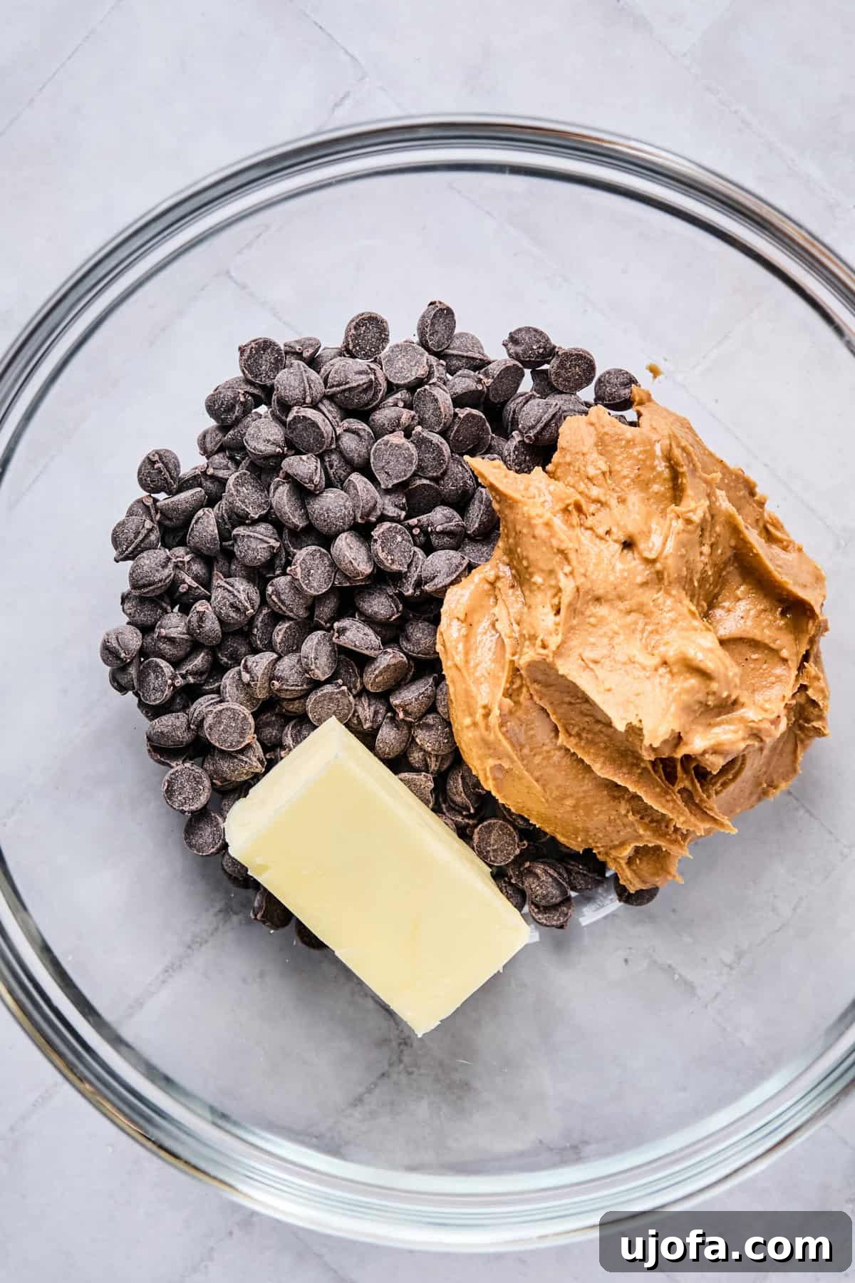 Chocolate chips, peanut butter, and butter in a microwave-safe bowl.