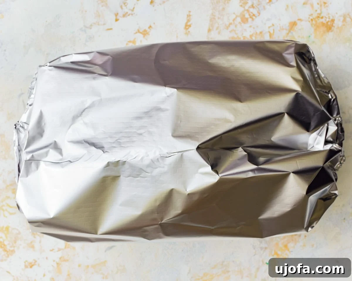Yalancı Peynirli Patates 9 A baking dish covered with foil