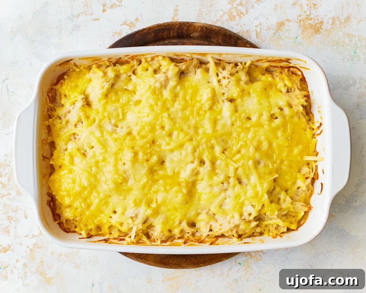 Yalancı Peynirli Patates 11 dairy-free cheesy potatoes in a baking dish.