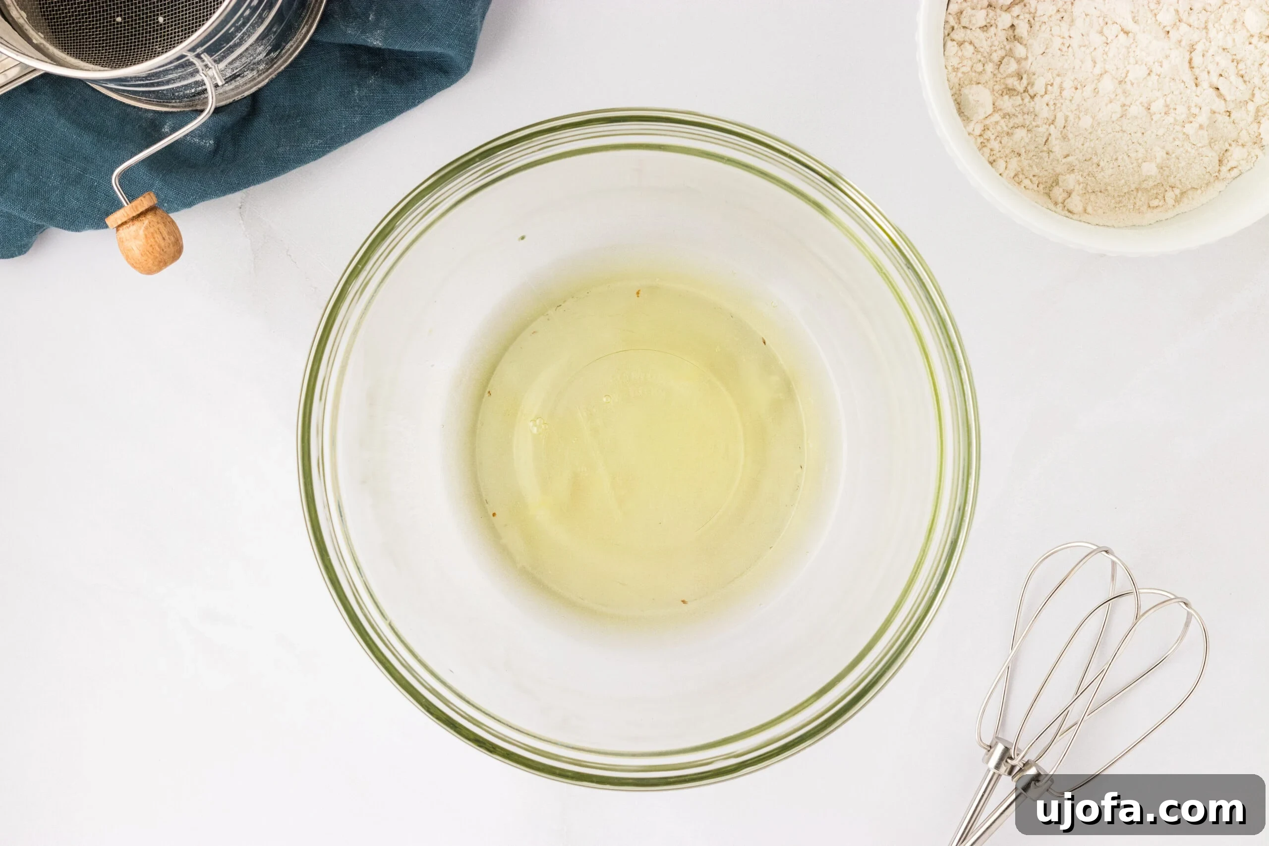 The Ultimate Gluten-Free Ladyfingers 10 egg whites in glass bowl on white counter