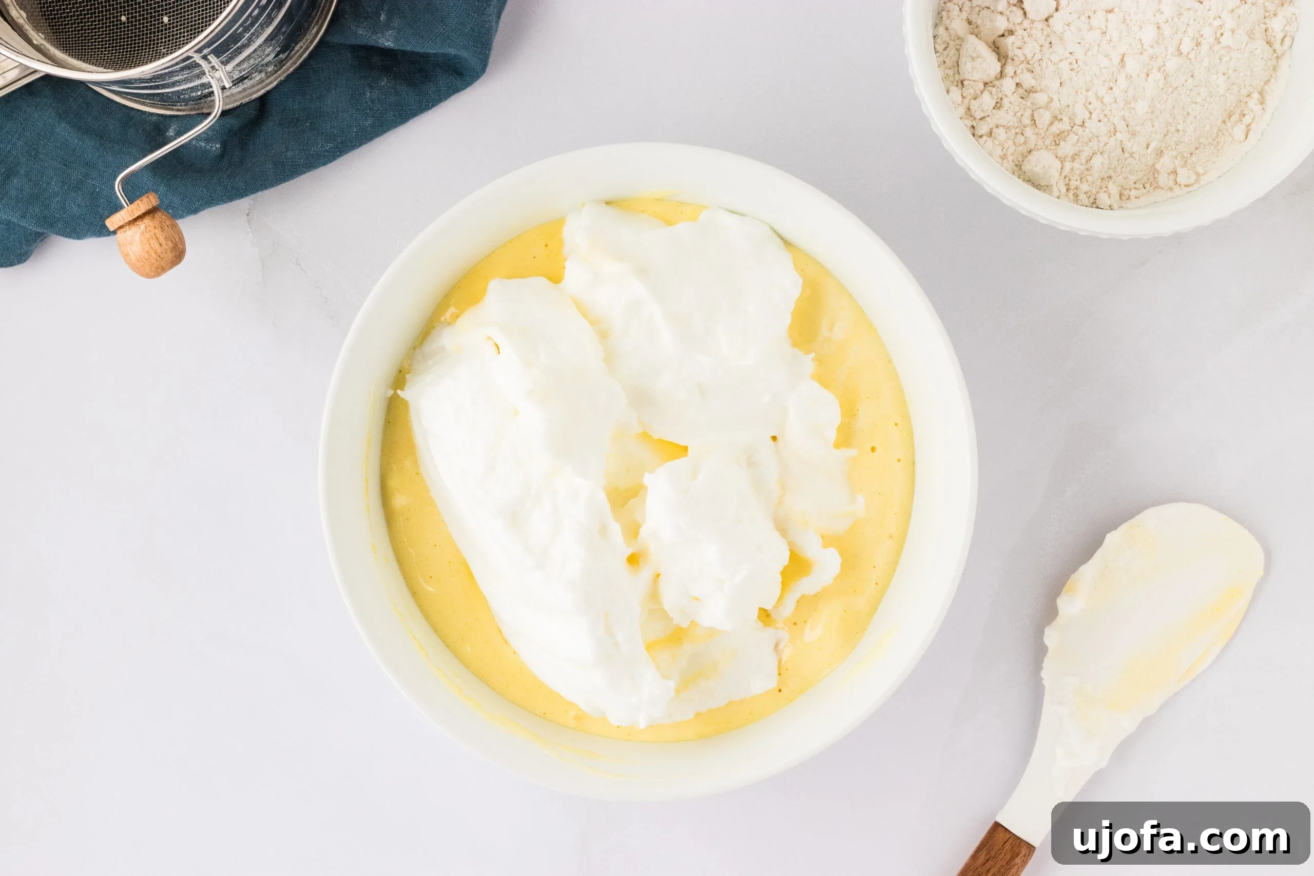 The Ultimate Gluten-Free Ladyfingers 13 whipped egg whites in bowl with egg yolk mixture