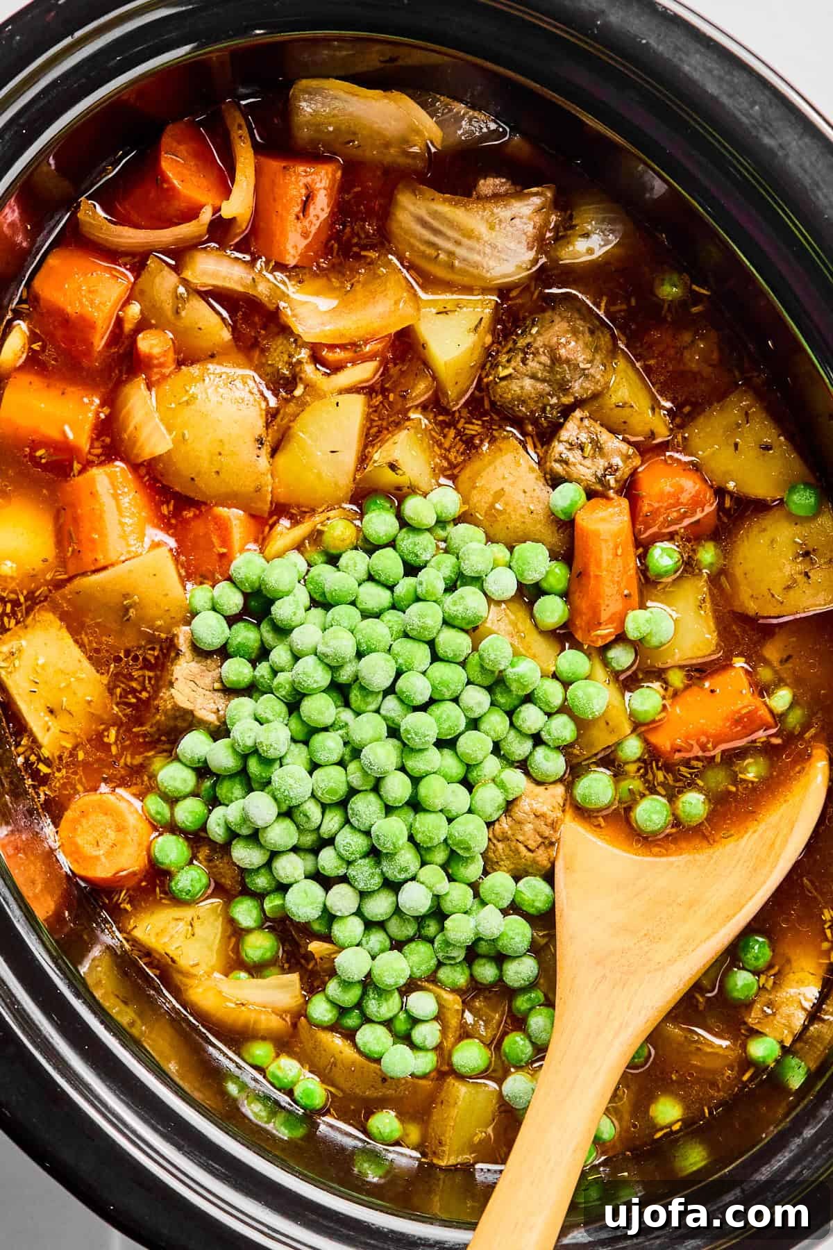 Set It and Forget It Hearty Beef Stew 9 Fresh peas stirred into the finished beef stew, with the arrowroot slurry prepared for thickening.