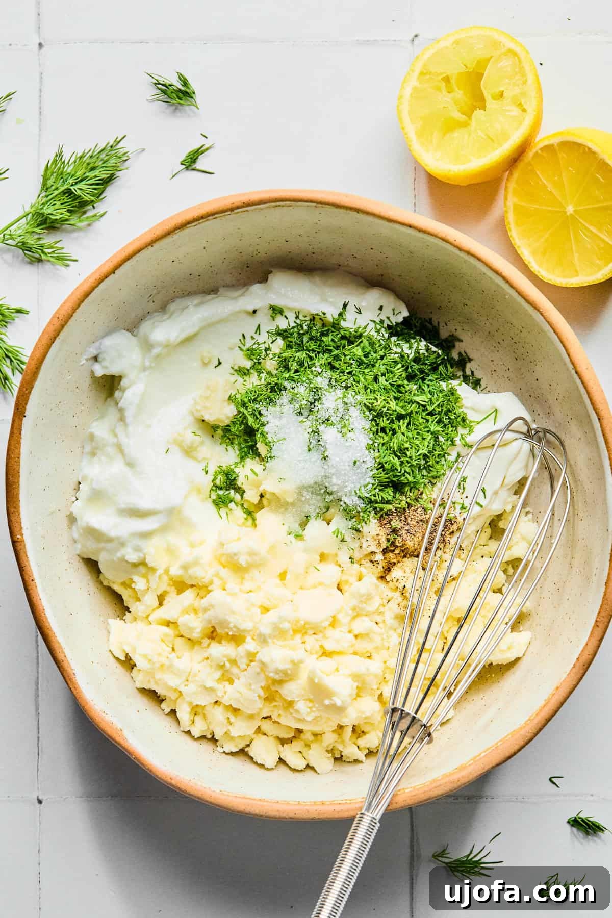 Lemon dill yogurt sauce ingredients in a small bowl.