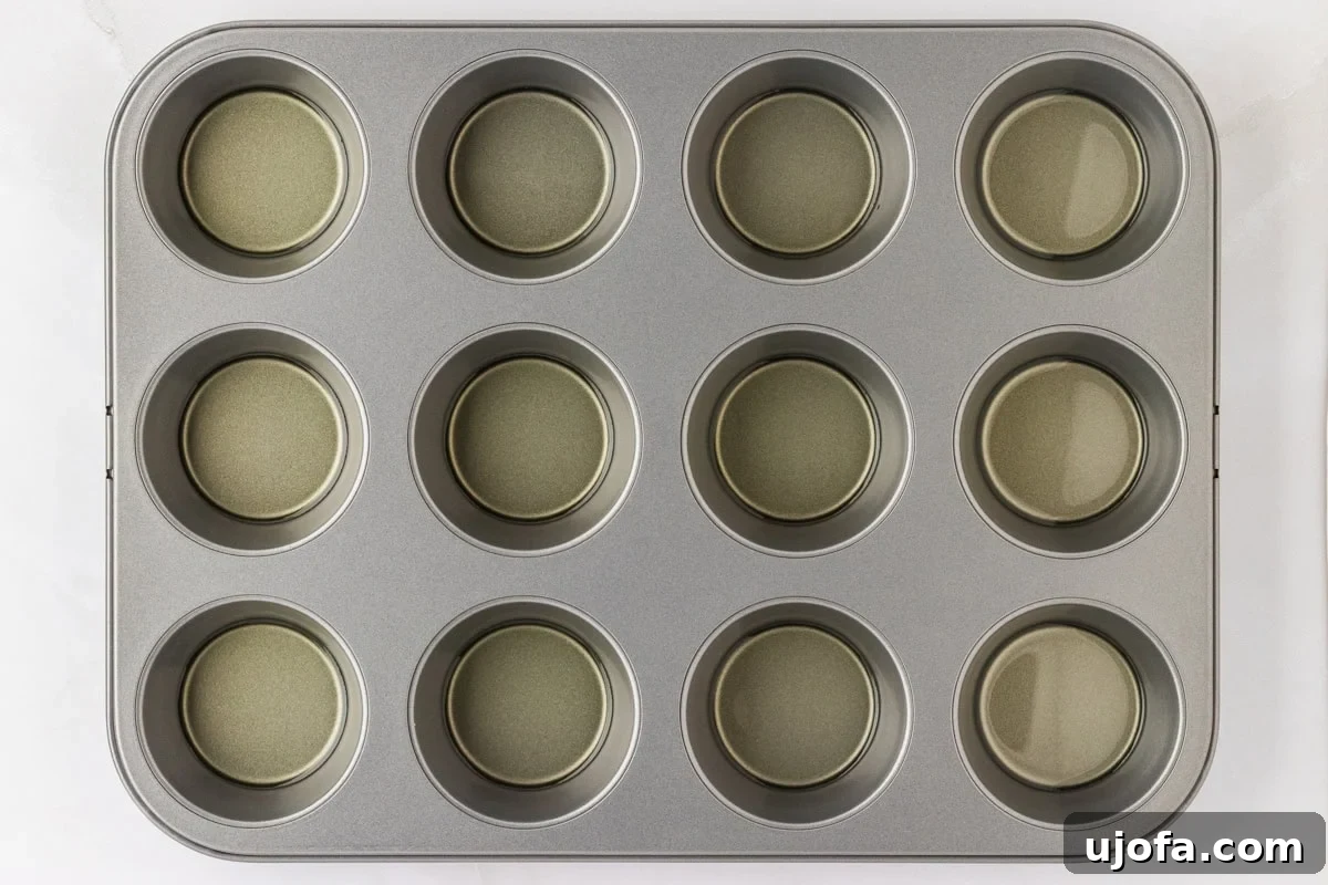 Perfect Gluten-Free Yorkshire Puddings 7 overhead shot of muffin tin with oil in each hole