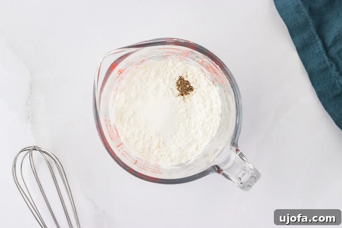 Perfect Gluten-Free Yorkshire Puddings 8 cornstarch, salt and pepper in glass measuring cup