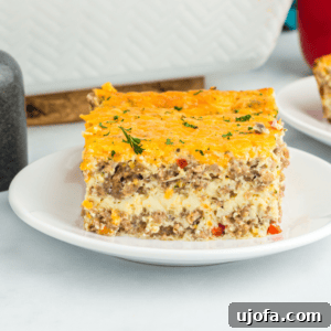 Yuletide Sausage Strata 6 piece of breakfast casserole on a white plate