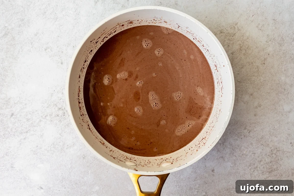 Plant-Based Chocolate Indulgence 9 overhead view of hot chocolate simmering in saucepan