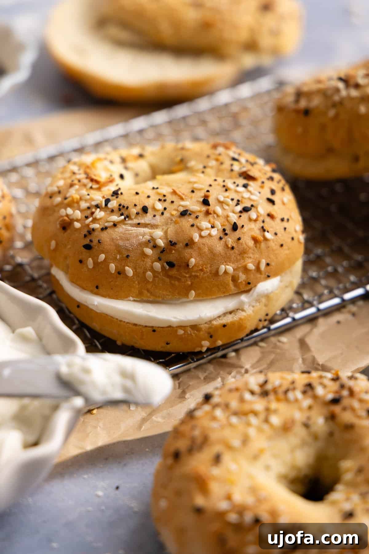 Effortless High Protein Gluten Free Cottage Cheese Bagels 7 Close-up of a cottage cheese bagel filled with cream cheese.