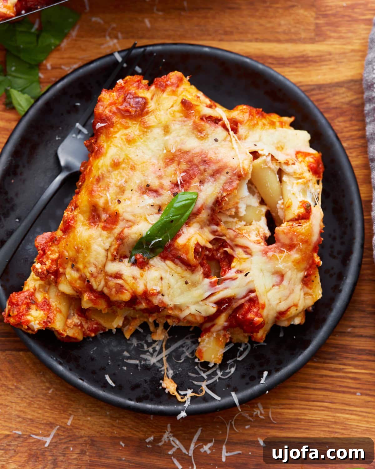 Comforting Gluten-Free Ziti Bake 4 overhead view of some gluten-free baked ziti on a black plate