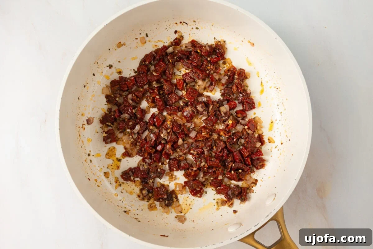 The Hummus Proposal 8 white pot with sun-dried tomatoes, shallots and garlic sautéing