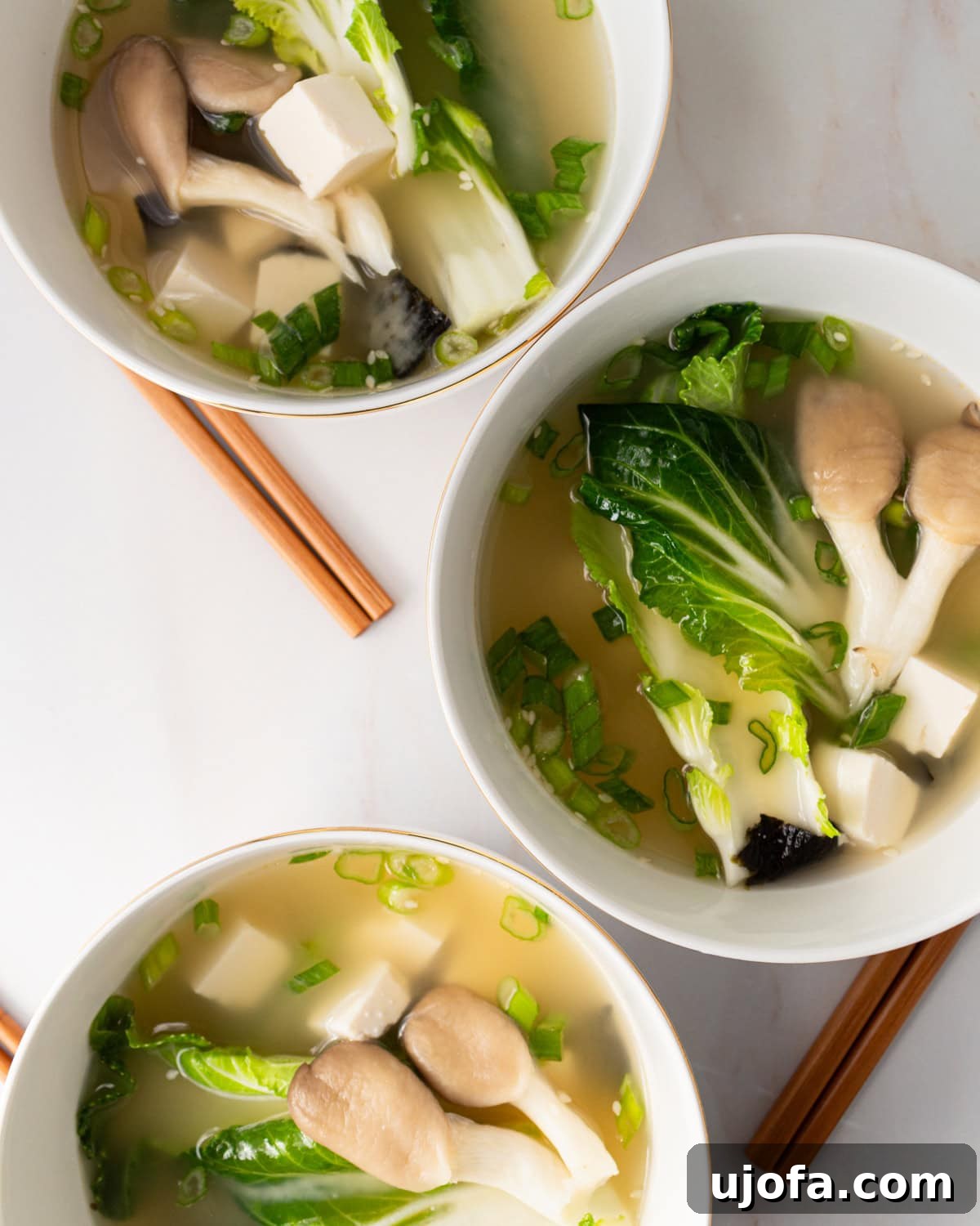 3 bowls of gluten free miso soup lined up vertically 