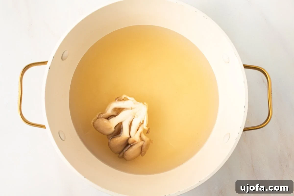 oyster mushrooms cooking in gluten-free miso soup broth