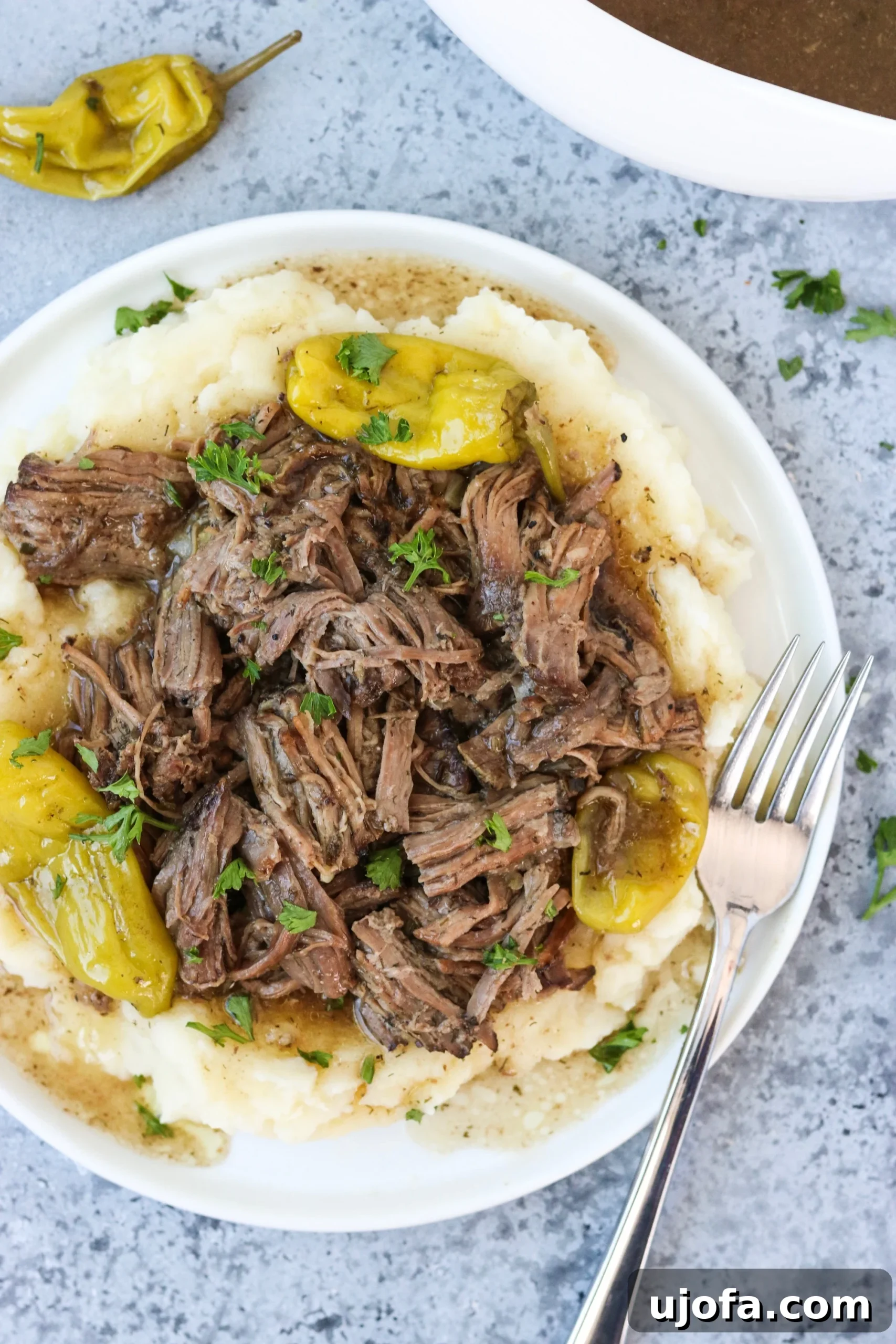 Wholesome Mississippi Pot Roast with Savory Beef Gravy 4 Spicy ranch roast shredded on top of garlic cauliflower mash